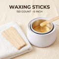 waxing sticks in a container and a towel